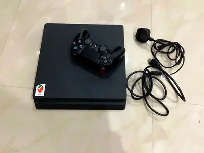 Sony PS4 Slim console with DualShock 4 and cables