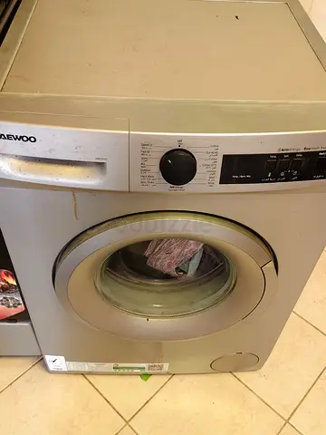 Used Daewoo front-load washing machine — working, needs cleaning
