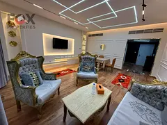 A furnished two-room apartment and a living room for annual rent in the Rashidiya 1 area - Horizon T