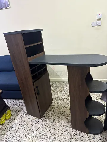 Wooden home bar cabinet with wine rack and countertop