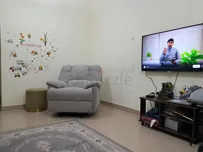 Grey recliner armchair, lightly used