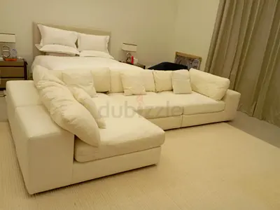 Super comfy Eichholtz Brand white color lshape sofa