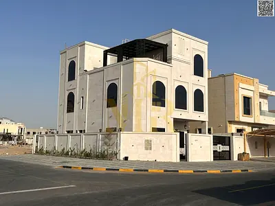 Corner villa for sale in Al Amrah area | Registration and ownership fees included | Close to Mohammed Bin Zayed Road and Emirates Road | Close to all