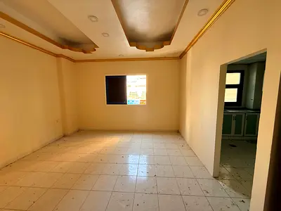 Spacious studio in Al Shuwaiheen with separate kitchen, practical design, AED 15,000 yearly, 6 cheques, prime location near services.