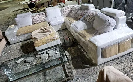 Beige L-shaped sectional sofa with ottoman