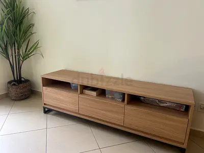 My low oak TV media console — great condition. Less than a year old! Looks great and stores better.