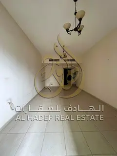 Two-Bedroom Apartment with Living Room for Rent in Al Qasba – Al Majaz 2, Sharjah | Parking and Ba