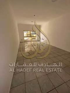 For annual rent in Sharjah: a two-bedroom apartment with a living room, excellent size, and a balcon