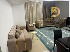 Two bedrooms and a large living room, overlooking the main street and the lake, with a small storage