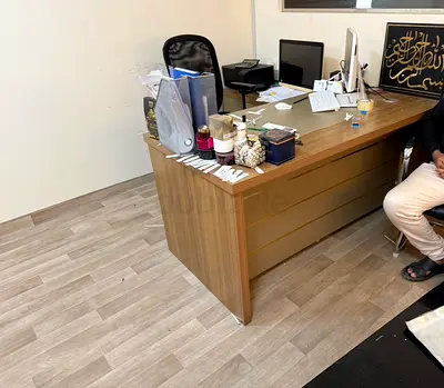 Large wooden office desk with drawers