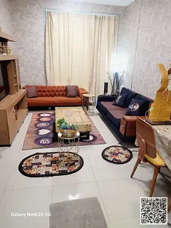 Luxury one-bedroom apartment with a living room and balcony offering sea views. Ajman Corniche. Full