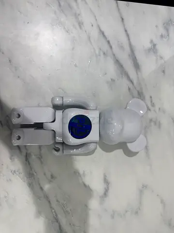 White Bearbrick-style vinyl bear collectible with blue chest decal PIL