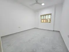 One-bedroom apartment in Al Rawda 2, Ajman, with a balcony offering an open view, central air condit