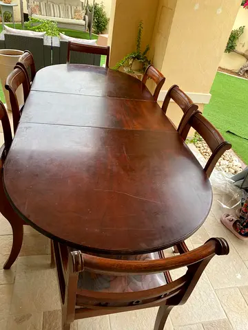 Wooden oval dining table (convertable) with 8 chairs - used