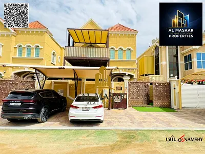 Villa for sale in Al Muwaihat area, Ajman, steps away from the school complex and the Saudi German Hospital. Includes electricity, water, and air cond