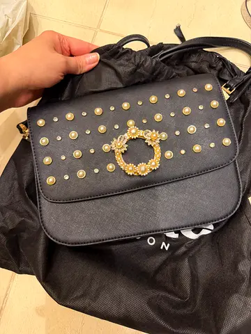 Black studded crossbody bag with gold floral clasp (gently used)