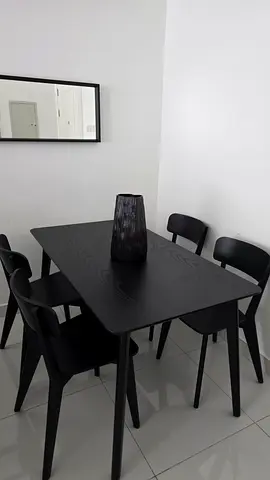 My black 4-seater dining table with 4 chairs