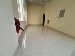 First-tenant shop in Al Nubai’a, new building, internal bathroom, AED 18,000 yearly, easy payments