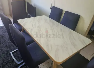 6-seater dining set with marble-look top and upholstered chairs