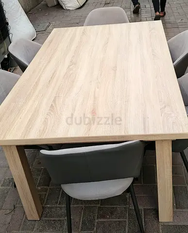 Stylish Dining Table with Comfortable Chairs