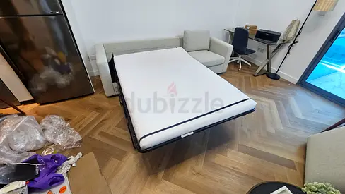 Beige Three Seater sofa bed with mattress