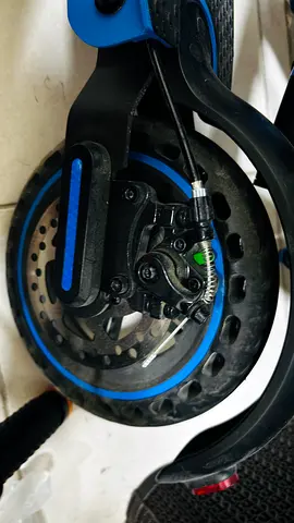 Blue electric scooter — front wheel with disc brake (used)