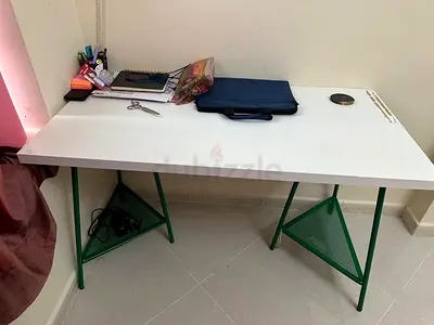 IKEA desk and a black desk chair