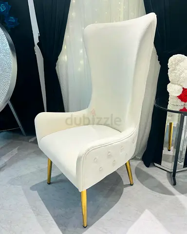 White upholstered high-back wingback accent chair with gold legs