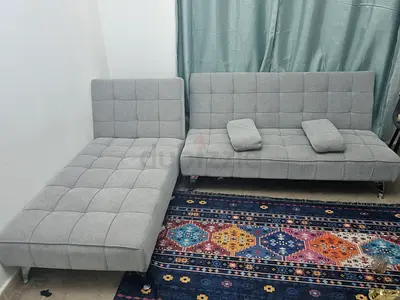 My grey fabric convertible sofa with chaise - good condition