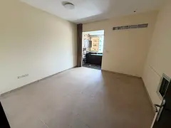 Studio apartment for annual rent in Al Rashidiya, Ajman, with a separate kitchen, spacious area, cen