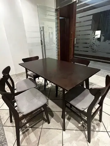 6-seater dark wood dining table with chairs