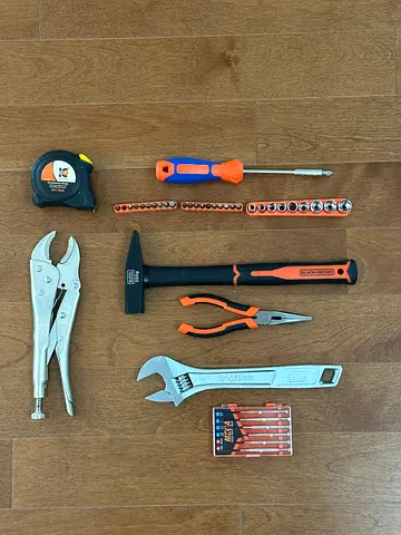 Set of like new hand tools — hammer, adjustable wrench, pliers, sockets