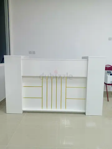 White reception counter / front desk with gold trim - used