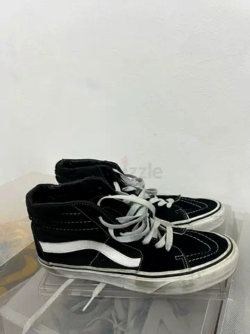 My black Vans Sk8-Hi high-top sneakers, used