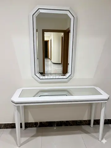 Mirror with a side table