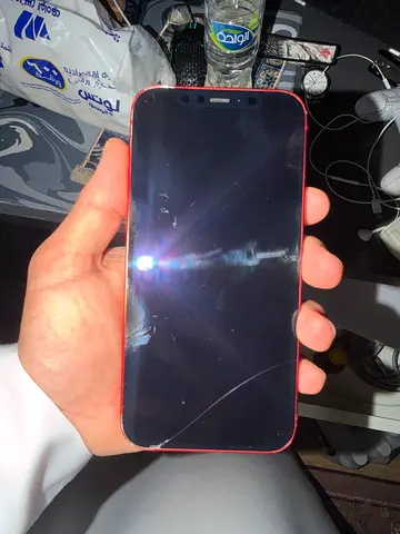 My red Apple iPhone 12 — screen cracked, selling as-is