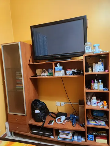 Wooden TV entertainment unit with glass-door cabinet and shelves