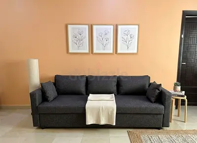 Elegant Grey Sofa Bed with Storage  Modern look with durable fabric and spacious seating. Convert