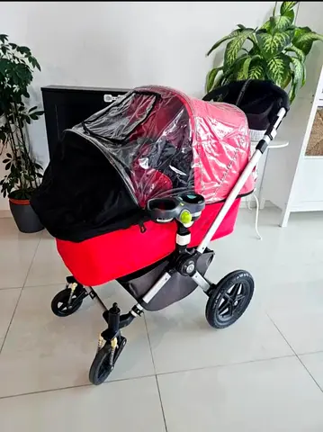 My bugaboo 2 red 3-wheel pram stroller with bassinet and rain cover