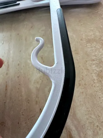 black  white plastic clothes hanger