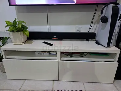 White TV entertainment unit with drawers and open shelves (used)