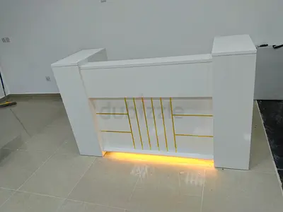 White reception counter with built-in LED lighting