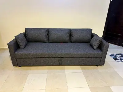 Stylish 3-Seater Sofa Bed – Storage Available  Sleek modern look with multi-purpose use. Cozy seat
