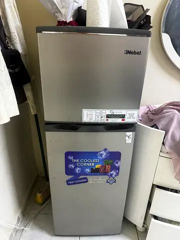 Compact stainless steel fridge with top freezer - working condition
