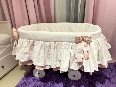 Picci Italian branded gently used pink ruffled bassinet/crib with wheels