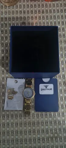 Womens gold-tone bracelet watch with box and extra links