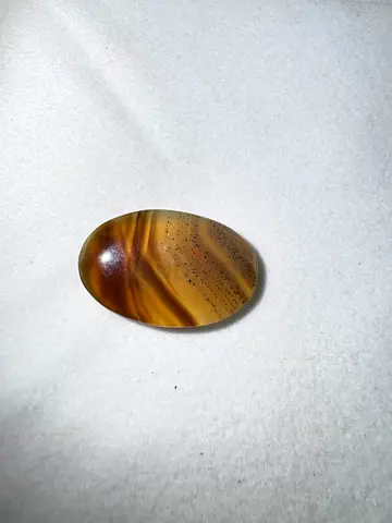 Polished brown banded stone cabochon Indian agate
