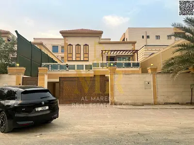 Villa for sale at an attractive price, suitable for residential or investment purposes, in Al Muwaihat area. It features three floors plus a roof terr