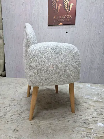 Beige bouclé upholstered accent/dining chair with wooden legs
