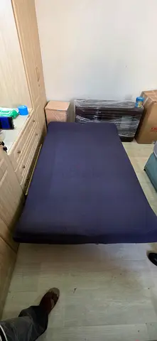 Used single mattress with navy cover